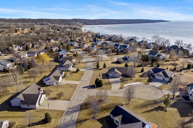 aerial view with a residential view and a water view