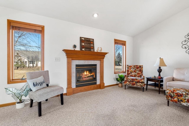 sitting room featuring a glass covered fireplace, recessed lighting, carpet flooring, baseboards, and vaulted ceiling