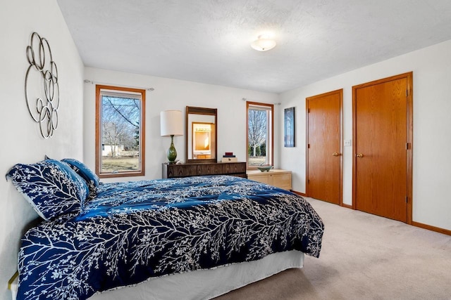 bedroom with carpet flooring and baseboards