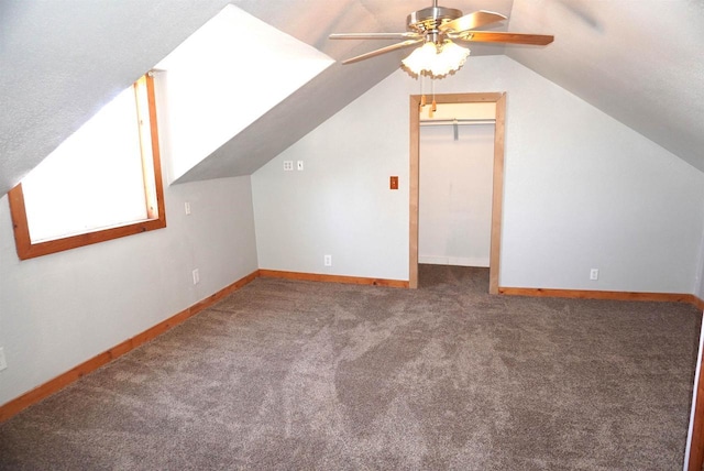 bonus room featuring carpet, ceiling fan, lofted ceiling, and baseboards