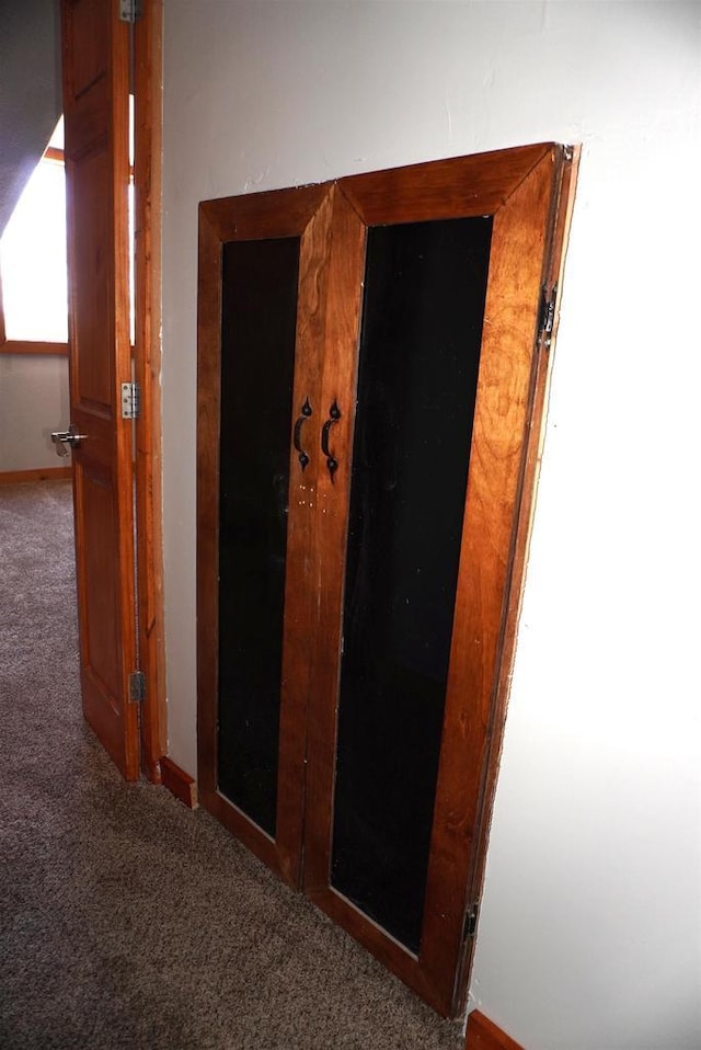 corridor with carpet floors