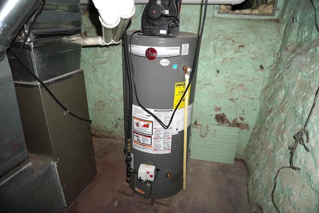 utility room featuring water heater and heating unit