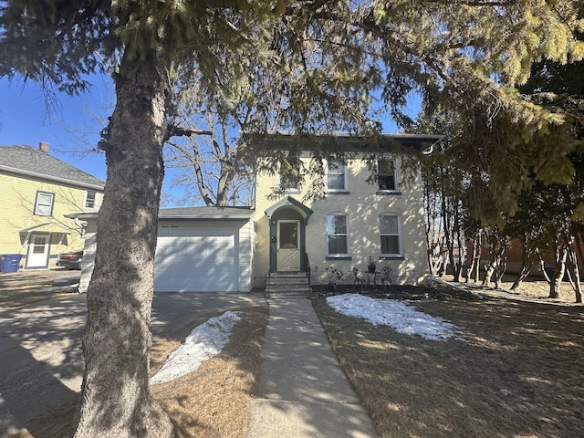 view of front of home with driveway and a garage