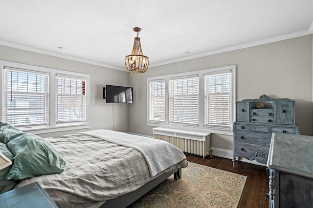 bedroom featuring a chandelier, dark wood-style flooring, ornamental molding, and radiator heating unit