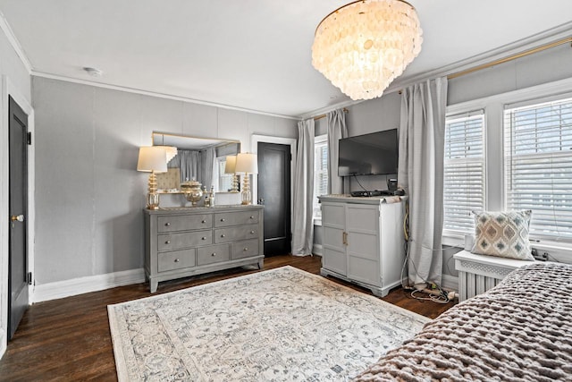 bedroom featuring a notable chandelier, wood finished floors, baseboards, ornamental molding, and radiator