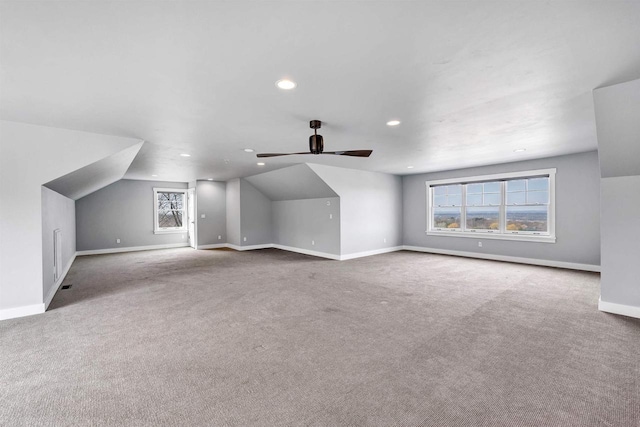 additional living space with carpet floors, lofted ceiling, baseboards, and recessed lighting