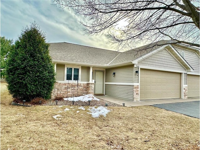 ranch-style house with stone siding, aphalt driveway, an attached garage, and a shingled roof