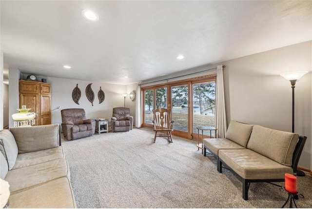 carpeted living area featuring recessed lighting