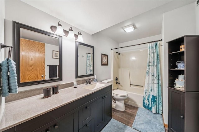 full bathroom with wood finished floors, vanity, toilet, and shower / bath combo with shower curtain