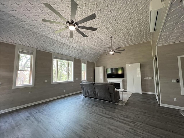 unfurnished living room featuring baseboards, a ceiling fan, dark wood-type flooring, a fireplace, and high vaulted ceiling