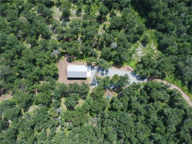 drone / aerial view with a view of trees