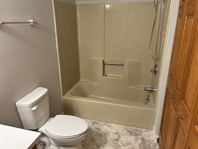 full bathroom with  shower combination, vanity, and toilet