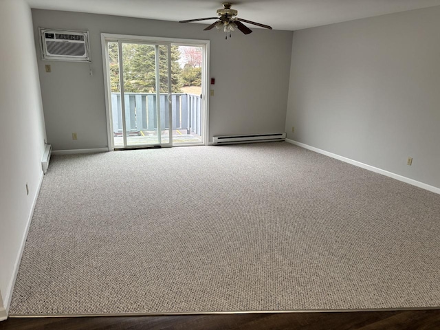 carpeted spare room featuring a ceiling fan, baseboards, baseboard heating, and a wall mounted AC