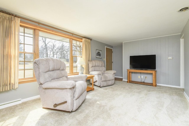 carpeted living area featuring a baseboard radiator, visible vents, and baseboards