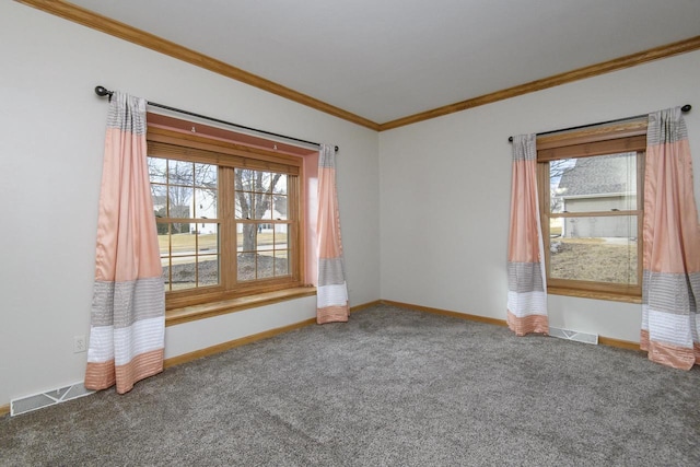 spare room featuring baseboards, visible vents, crown molding, and carpet flooring