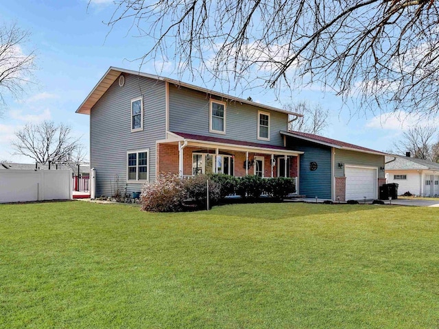 traditional-style house with a front yard, brick siding, fence, and an attached garage