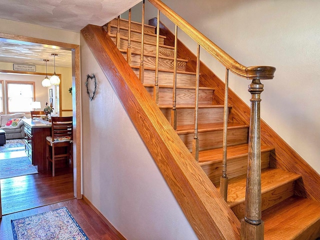 staircase featuring hardwood / wood-style floors