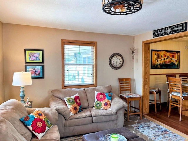 living area with a textured ceiling and wood finished floors