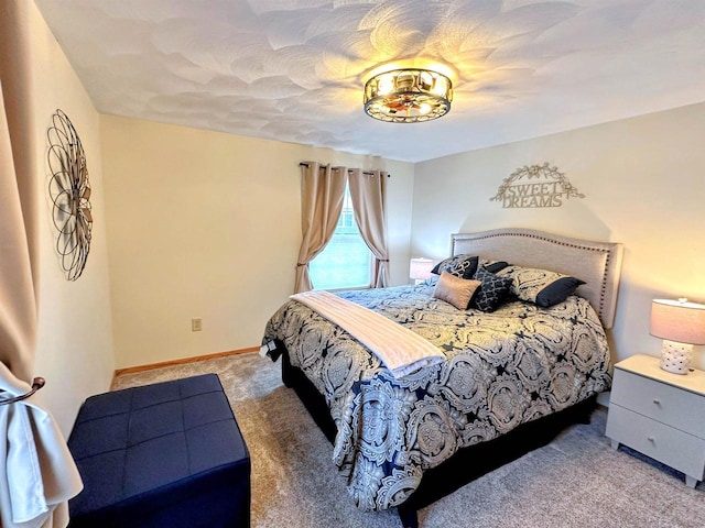 bedroom with carpet and baseboards