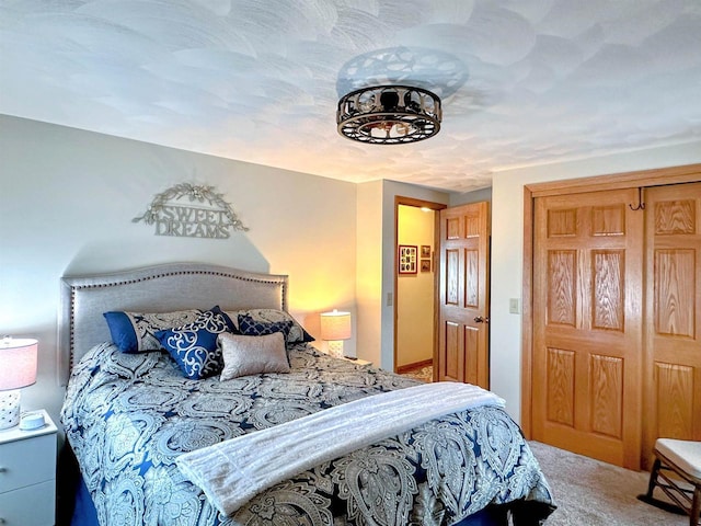 carpeted bedroom featuring a closet