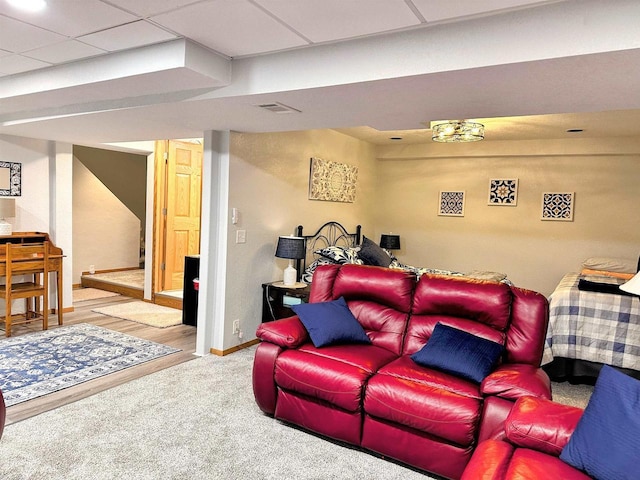 interior space with visible vents, baseboards, and a drop ceiling