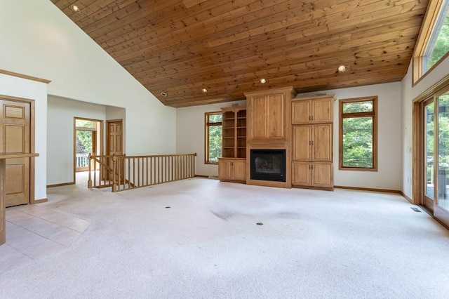 unfurnished living room featuring wood ceiling, a fireplace, high vaulted ceiling, and light colored carpet