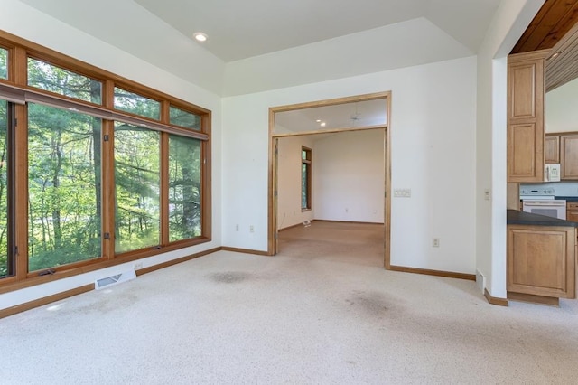 empty room featuring recessed lighting, visible vents, light carpet, and baseboards