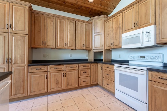 kitchen with wooden ceiling, white appliances, dark countertops, and light tile patterned flooring