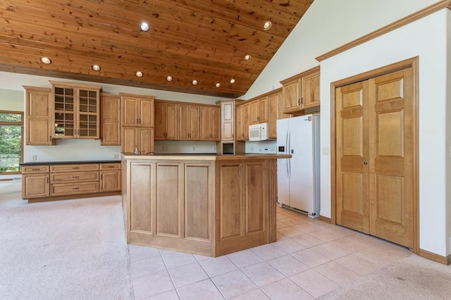 kitchen featuring recessed lighting, glass insert cabinets, wood ceiling, light tile patterned flooring, and white appliances