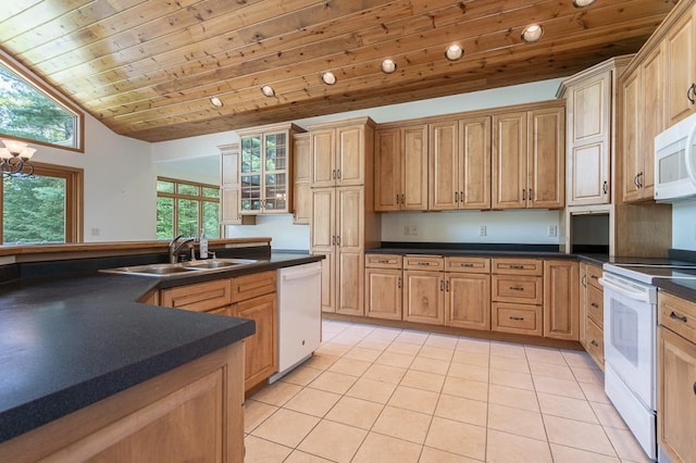 kitchen with white appliances, light tile patterned floors, dark countertops, wooden ceiling, and a sink