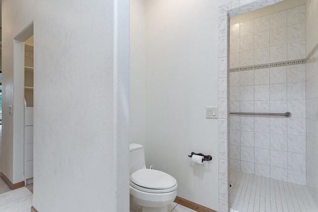 bathroom with walk in shower and toilet