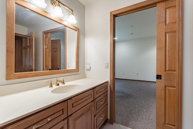 bathroom with vanity and baseboards