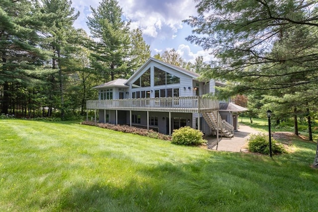 back of property featuring a patio area, stairs, a deck, and a yard