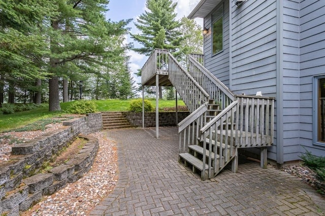 view of patio / terrace featuring a deck and stairway