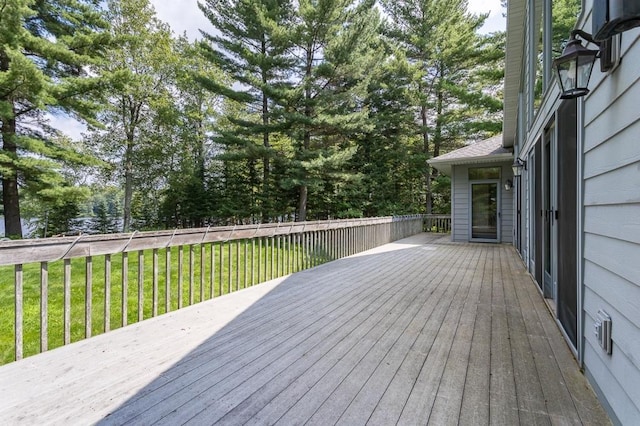 wooden deck with a yard