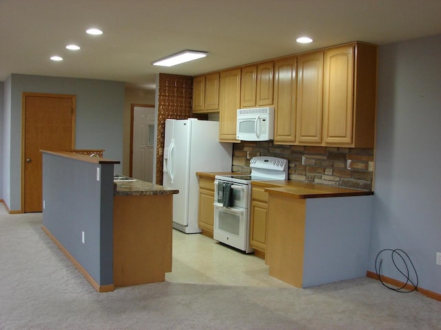 kitchen with white appliances, light brown cabinetry, backsplash, and recessed lighting