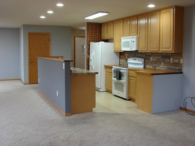 kitchen with light carpet, white appliances, tasteful backsplash, and recessed lighting