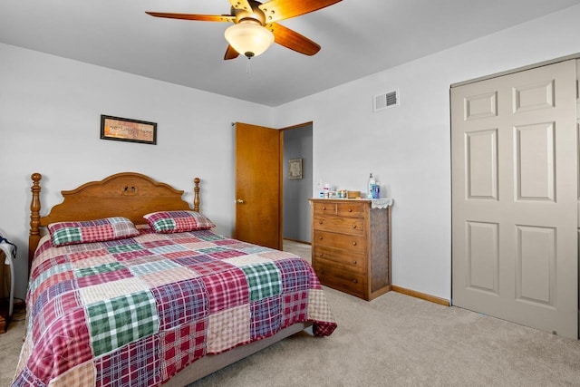 bedroom with ceiling fan, carpet floors, visible vents, and baseboards