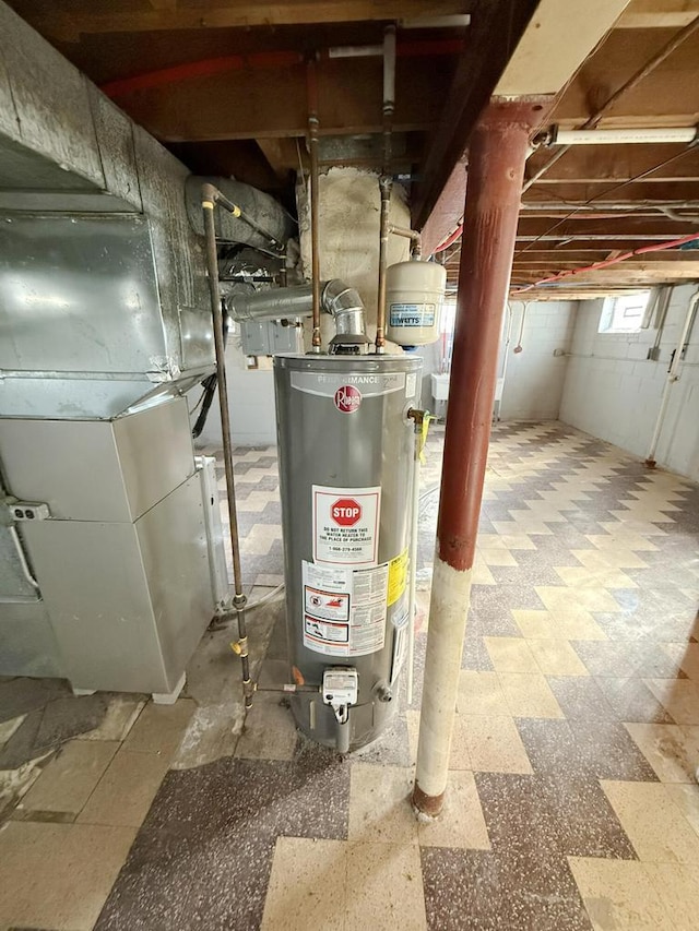 utility room with heating unit and gas water heater