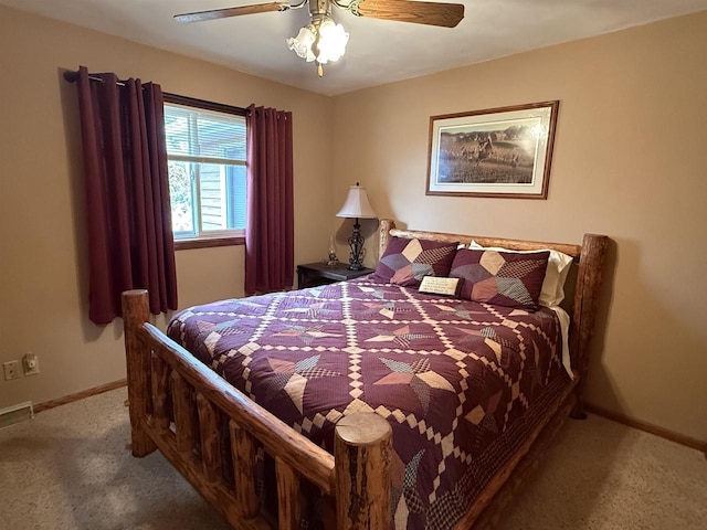 carpeted bedroom with baseboards and a ceiling fan