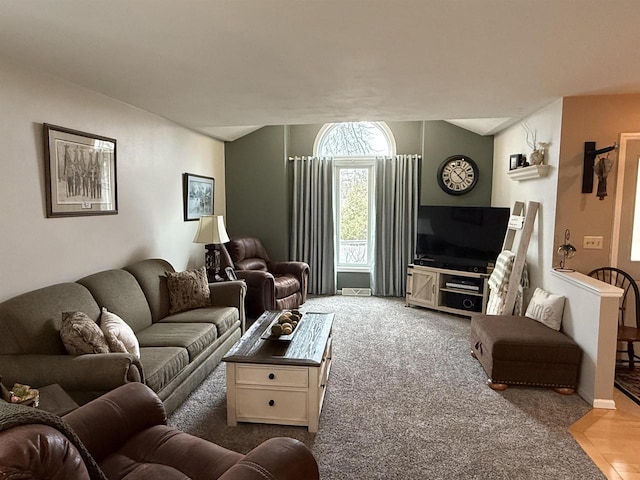 living room featuring vaulted ceiling