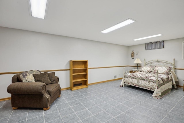 bedroom featuring baseboards