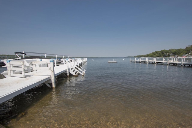 view of dock with a water view and boat lift