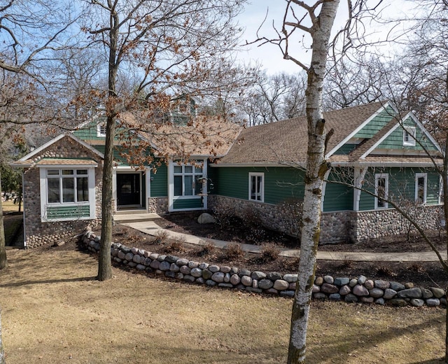 1019 Tarrant Dr, Fontana, WI 53125 - craftsman-style house featuring roof with shingles and stone siding