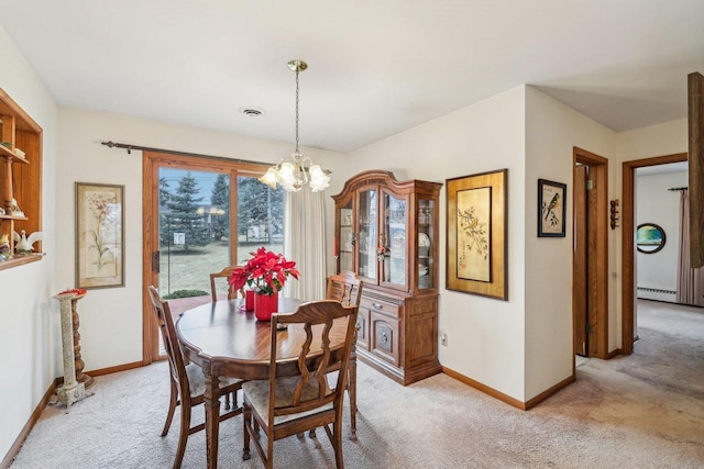 dining room with light carpet, a notable chandelier, visible vents, and baseboards