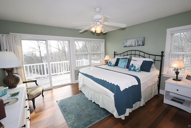 bedroom featuring access to outside, multiple windows, ceiling fan, and hardwood / wood-style floors