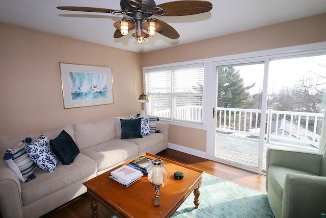 living area with wood finished floors and baseboards