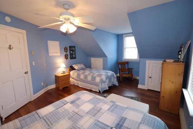 bedroom featuring lofted ceiling, dark wood-style floors, ceiling fan, and baseboards