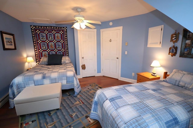 bedroom with a ceiling fan, wood finished floors, attic access, and baseboards