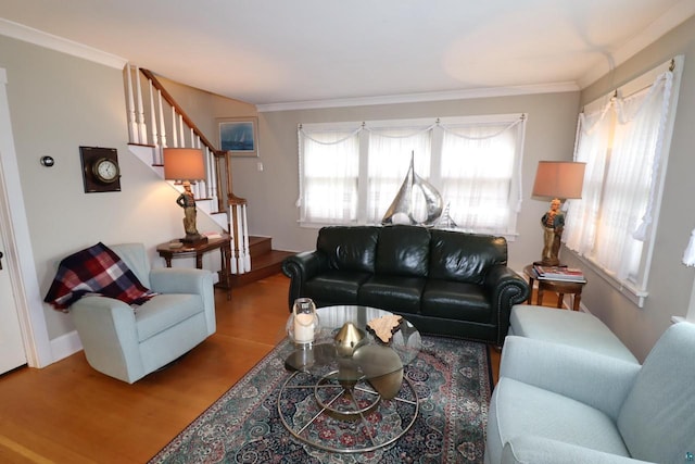 living room featuring crown molding, stairway, and wood finished floors